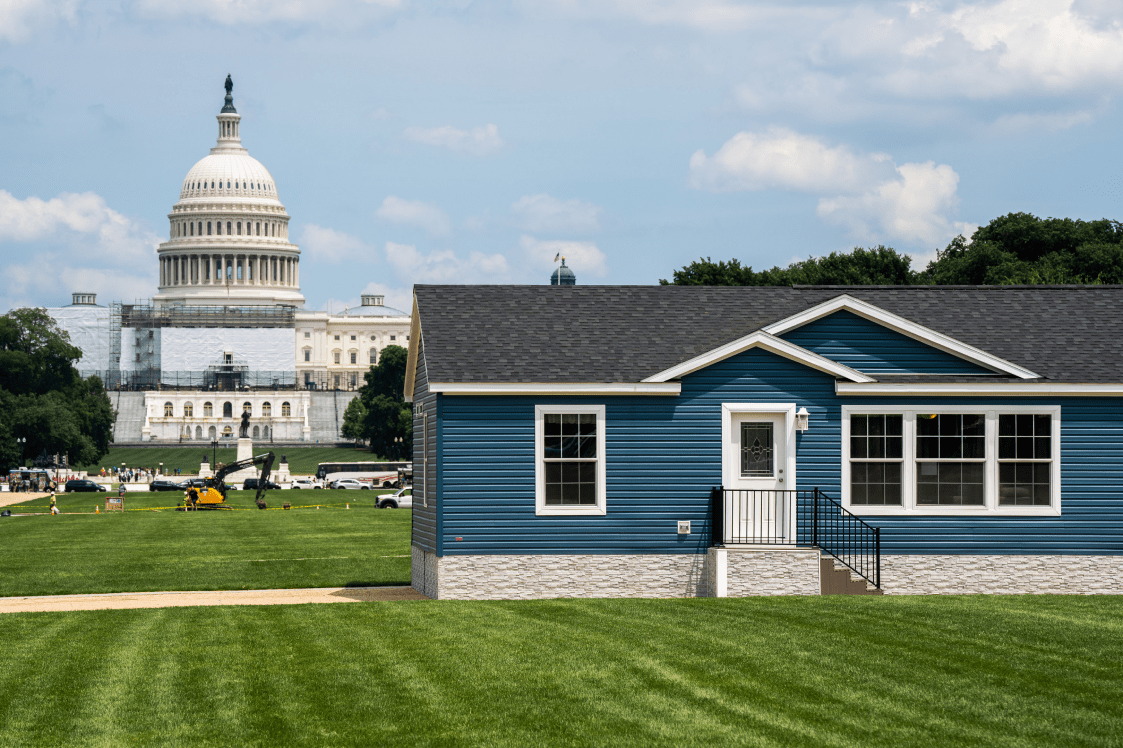 Blue Manufactured Home on National Mall with Capitol Building in Background