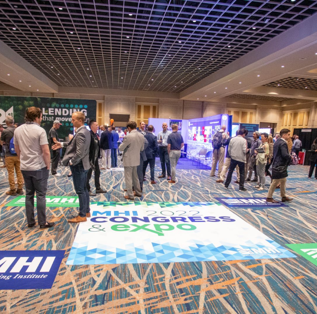 Entrance to Bustling Expo Floor with Blue Congress and Expo Sign on Floor