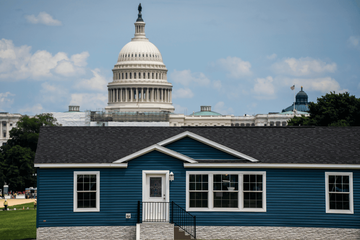 Blue Manufactured home in front of capitol