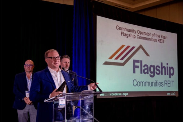 Man speaking on stage at event