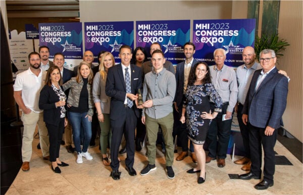 Large group holding award and posing