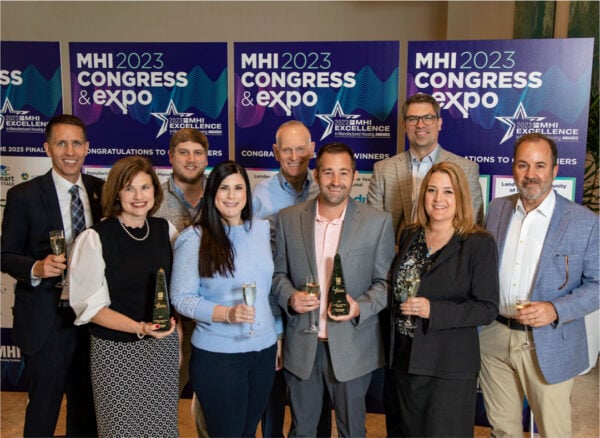 Large group holding awards and posing