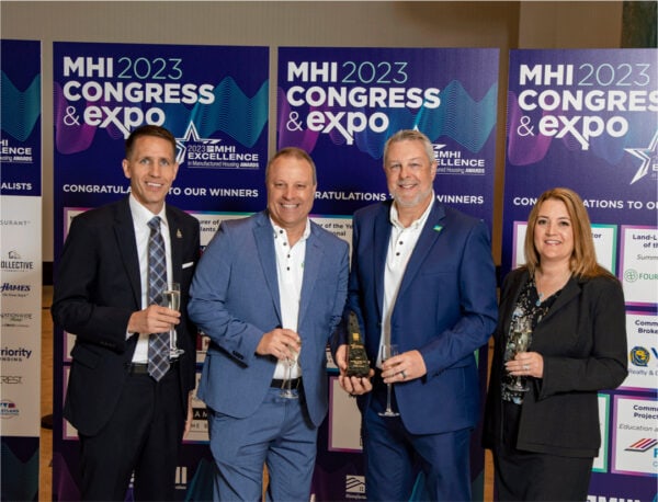 Group holding award and posing