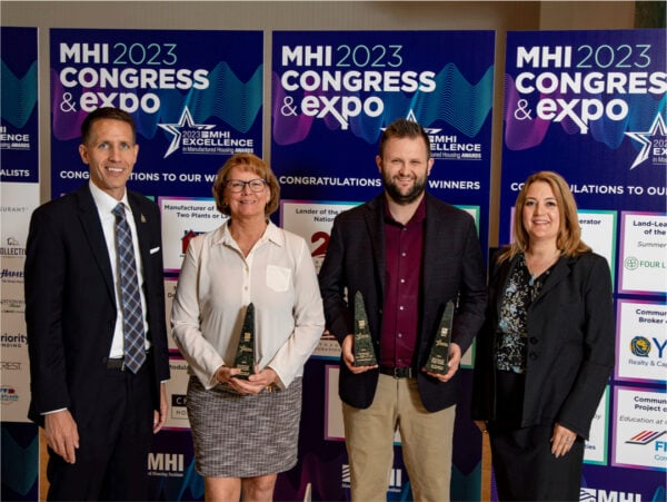 Group holding award and posing