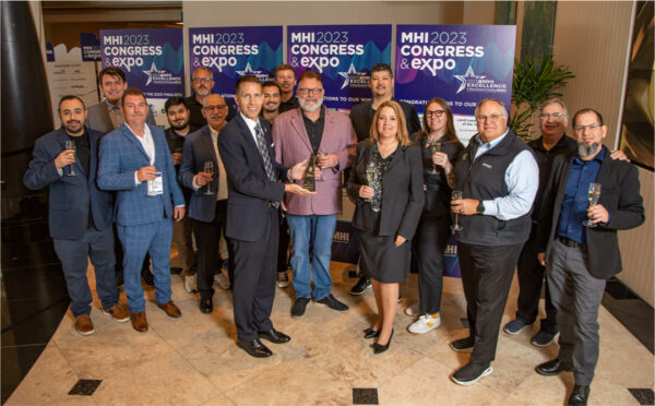 Large group holding award and posing