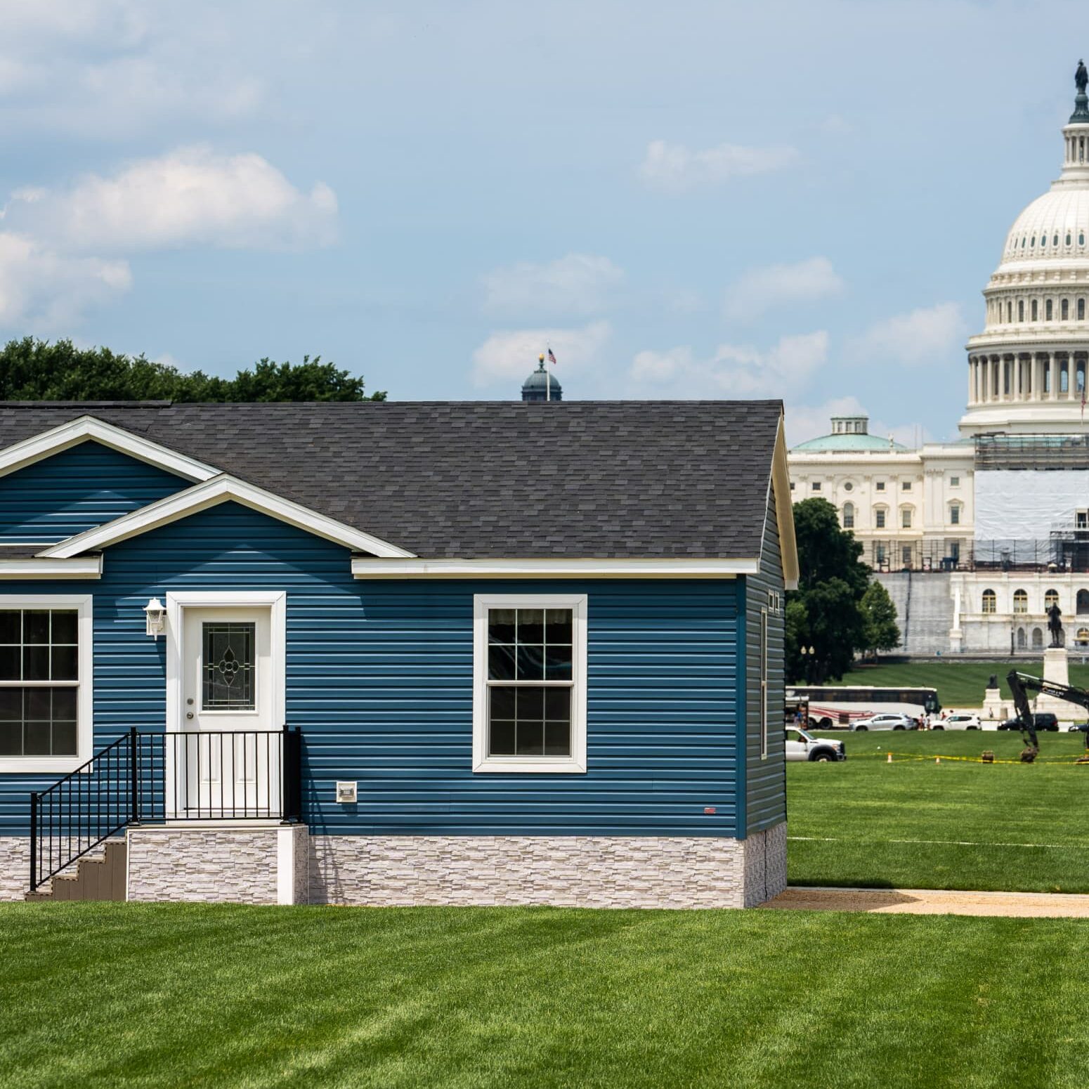 Blue Manufactured Home on National Mall with Capitol Building in Background