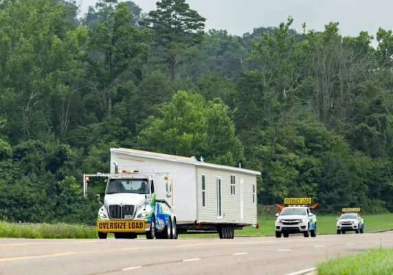Clayton Delivery Truck carrying a manufactured home